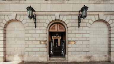 Photograph of curved doorway into Bank of Ireland building. 