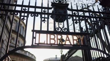 Library signage on gate