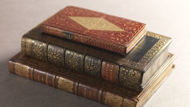 Pile of three books stacked on top of each other