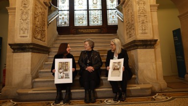 Ciare Kerrigan, Annie West and Dr Audrey Whitty sitting on stairs
