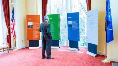 Man staring at banner exhibition