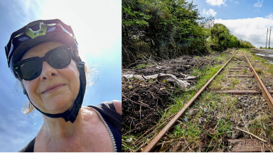 Woman on bike and railway