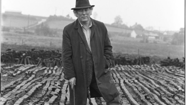 Seamus Heaney standing in a bog