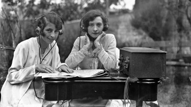 Two women operating radio equipment