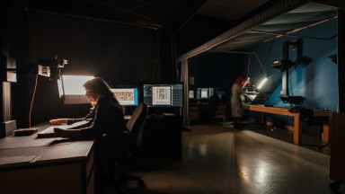 Two women working inside the NLI's digital studio