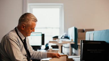 James Harte seated at a desk