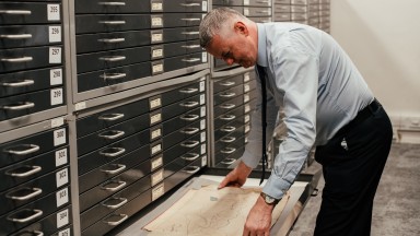 James opening a drawer
