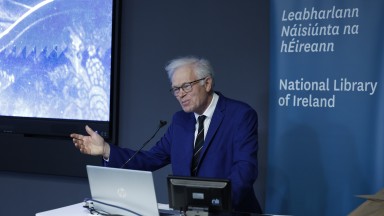 Man speaking from a lectern