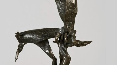 Abstract bronze sculpture depicting a dynamic, elongated centaur-like figure with angular, textured surfaces. The form balances gracefully on two slender legs atop a light stone base, with its upper body and arms extended upward in an expressive, energetic pose.