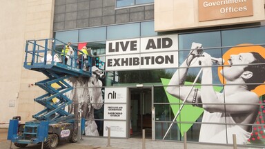 Live Aid Exhibition Decal on Exterior of Office Space 