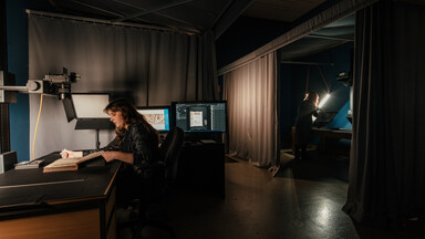 Behind the scenes view of NLI staff working on digitisation projects.
