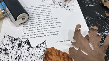 An image of autumn leaves and printing equipment and printed leaves on poems.