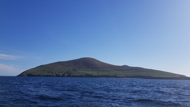 A photograph of an island from across the water