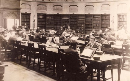 A sepia photo of the NLI Reading Room in use in 1880