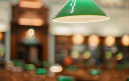 A green reading lamp in NLI Main Reading Room