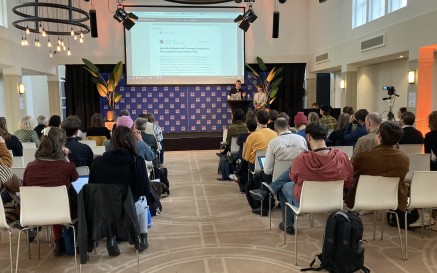 photograph of NLI staff presenting to a crowd in No Time To Wait in The Hague - October 2022