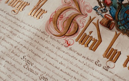 Close up of old manuscript with embellished lettering