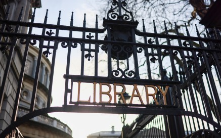 Library signage on gate