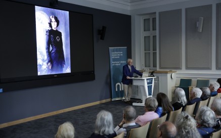 Man giving lecture to a group of people