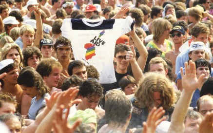 A Live Aid t-shirt being raised in the crowd at JFK Stadium