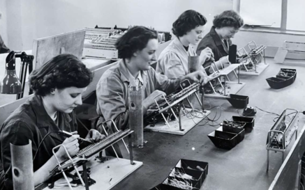 women working on machines