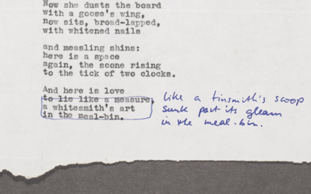 Typewritten poem draft with blue pen annotations.