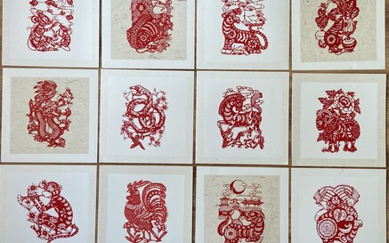 red woodblock prints of zodiac characters