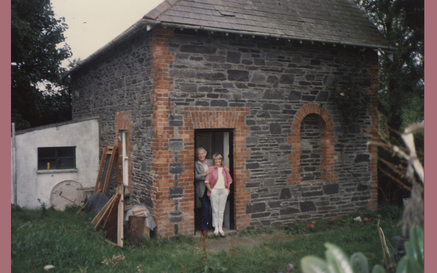 a photo of heaney and marie standing in the doorway of their house in Glanmore