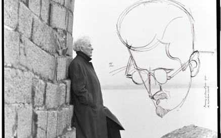 Heaney standing in front of the sea with sketch of joyce
