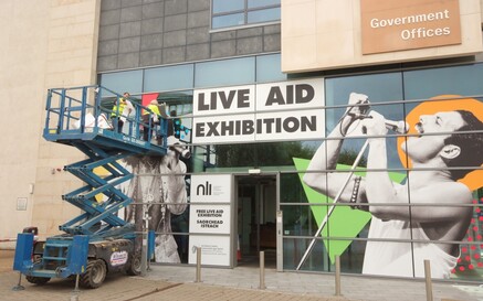 Live Aid Exhibition Decal on Exterior of Office Space 