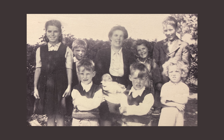 A black and white image of Margaret Heaney and her children, including Seamus