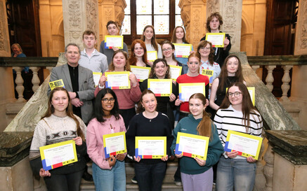 Group of young TY Reveal students holding certificates